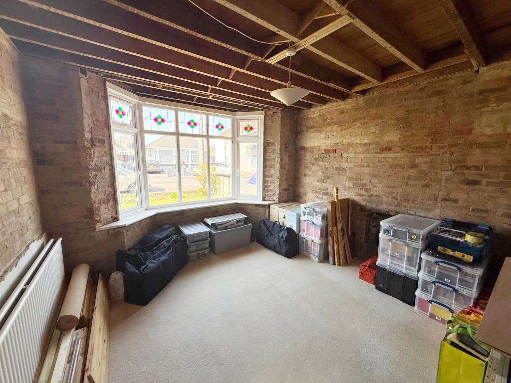 Lot: 143 - FREEHOLD DETACHED HOUSE FOR IMPROVEMENT WITH STRUCTURAL MOVEMENT - The Living Room looking towards the street